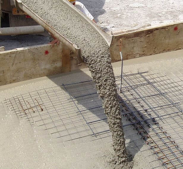 Ready mix concrete pouring from a cement mixer